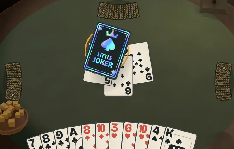 A Spades Night table mid-trick: the Little Joker lands on a spade, with the player’s hand fanned below.